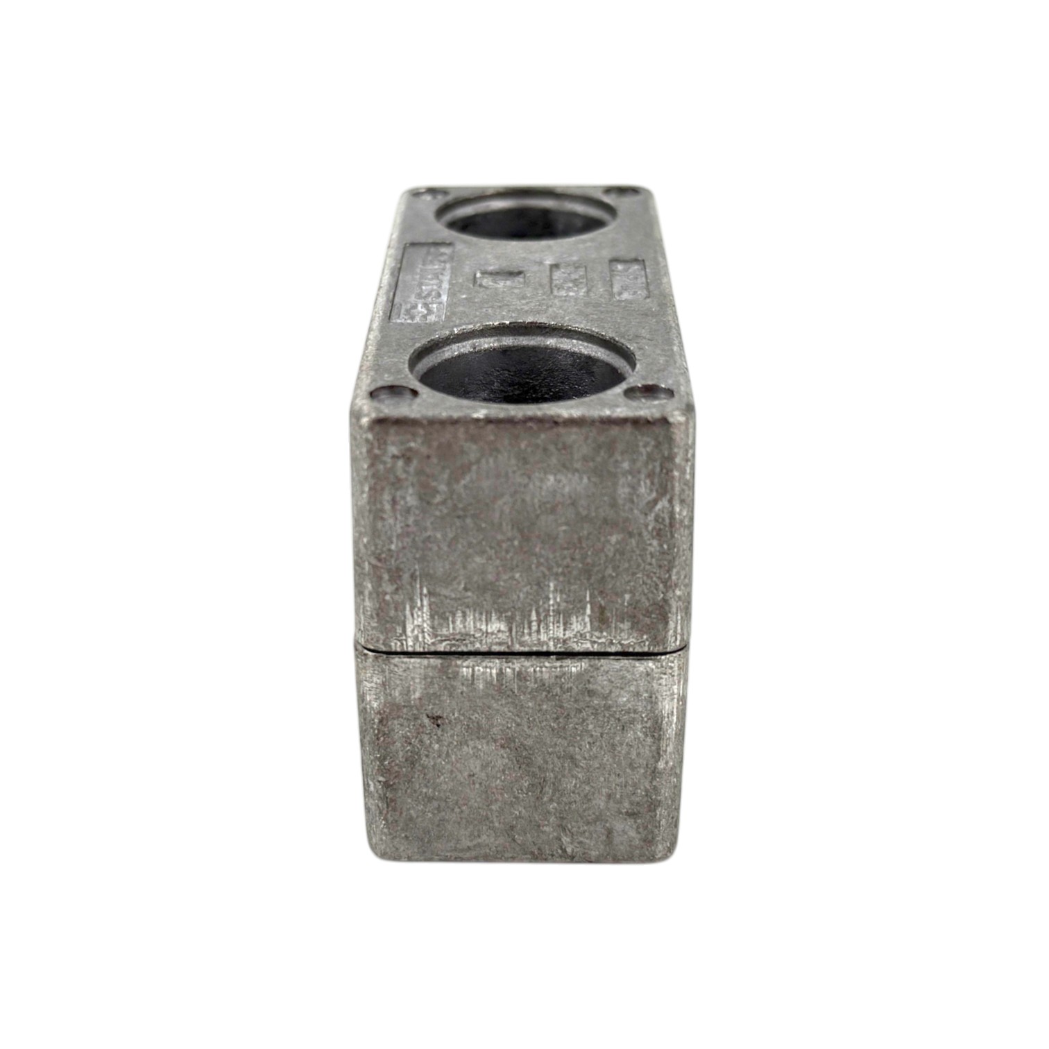 STAUFF Schelle Schwere Baureihe aus Aluminium, ein grauer, rechteckiger Klemmblock mit zwei runden Öffnungen auf der Oberseite, vor weißem Hintergrund.